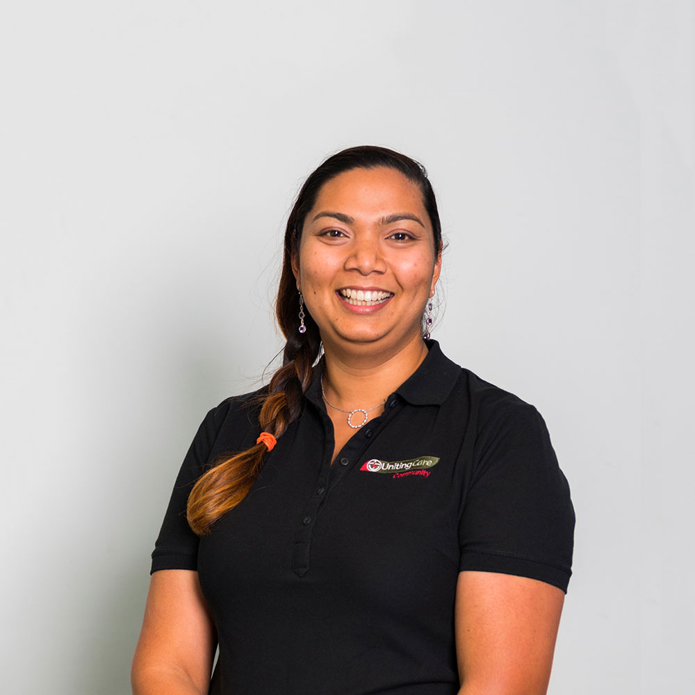 young female staff member smiling