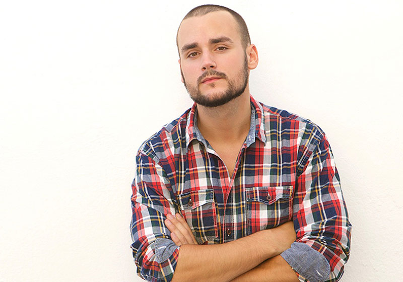 young man with a tartan shirt
