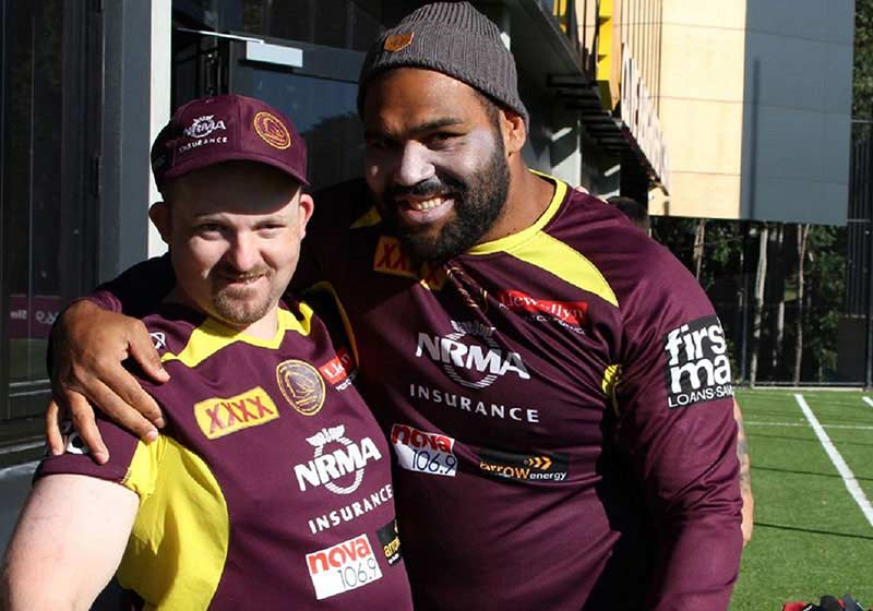 two men with Brisbane Broncos t-shirts