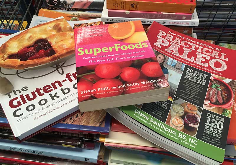 cook books scattered across a table
