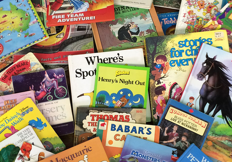 a variety of children's book displayed on a table