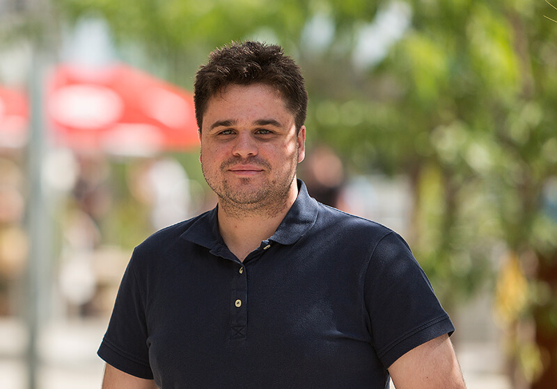 Man standing outside smiling at camera