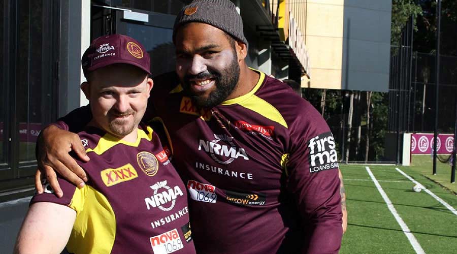 two men with Brisbane Broncos t-shirts
