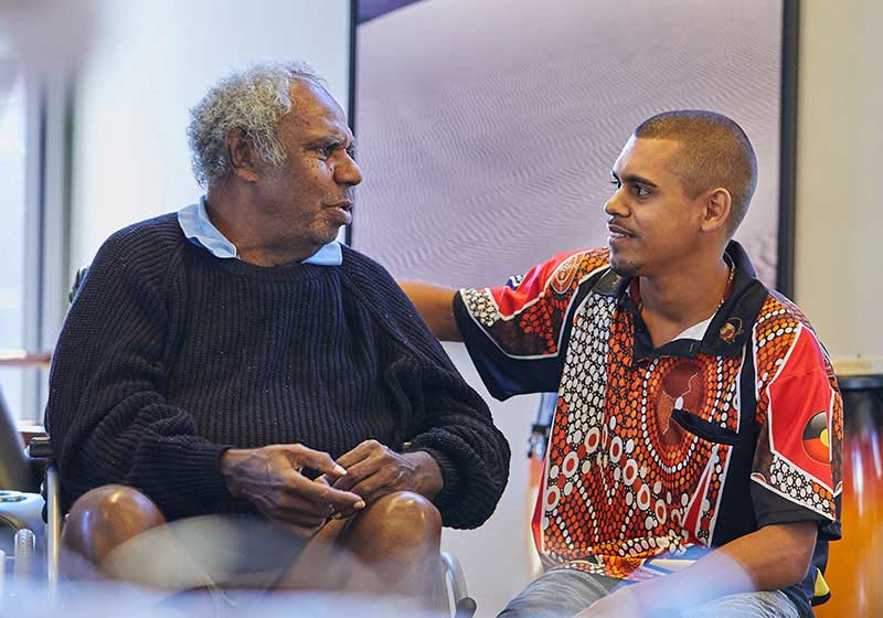 Two men sitting down