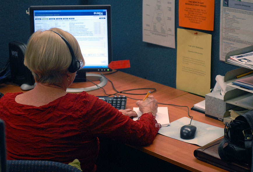 woman call centre worker at her desk