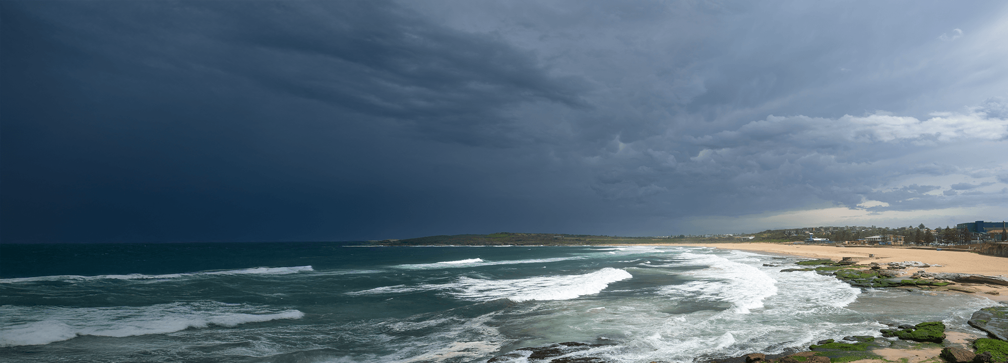 Dark clouds gathering over a beach