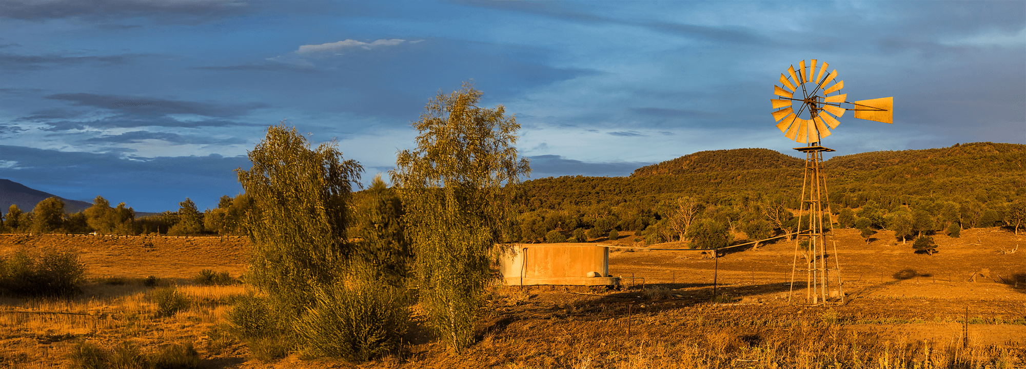 Farm in the outback with a classic metal windmill