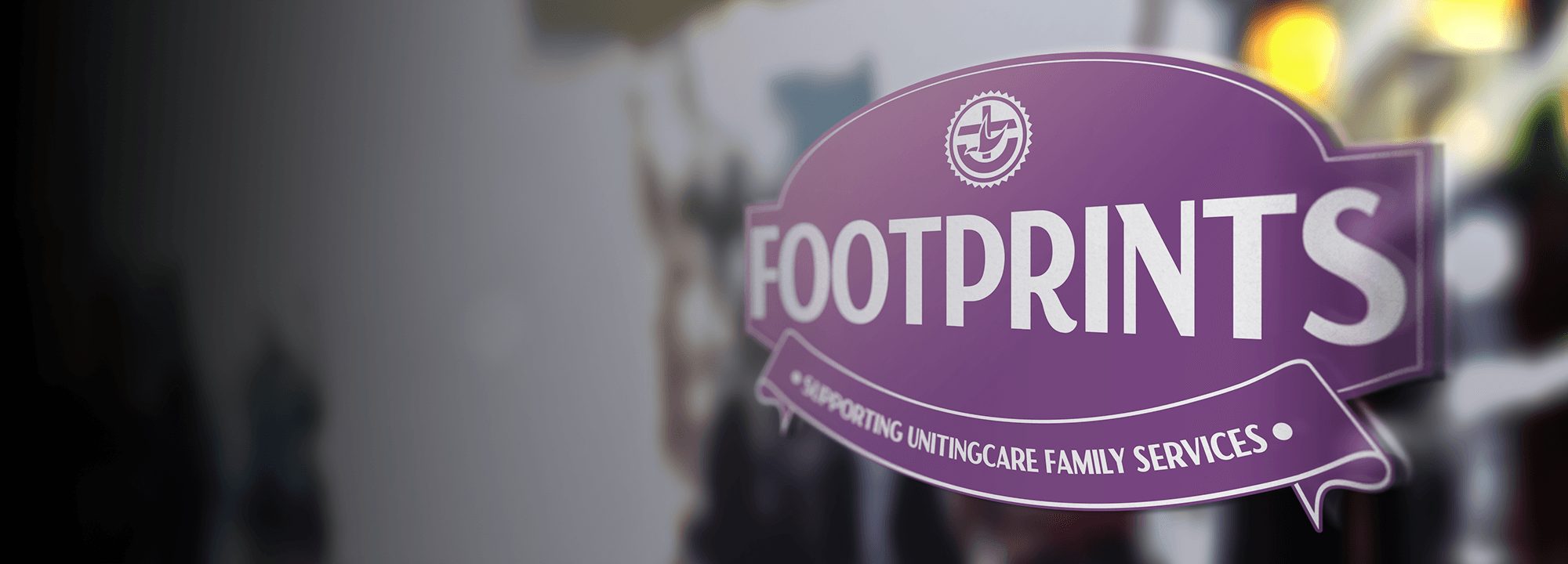 Footprints logo on a shop window