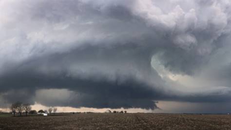 Dark clouds over a field