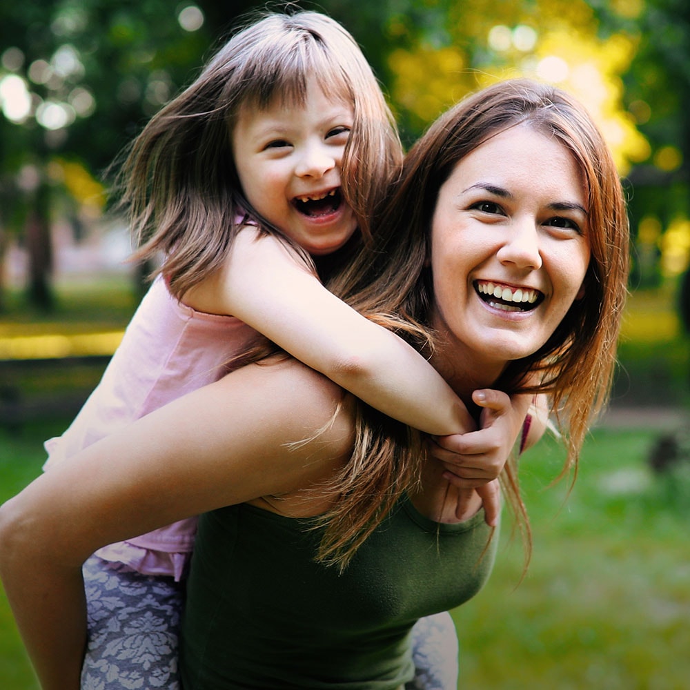 happy mother and child with disability