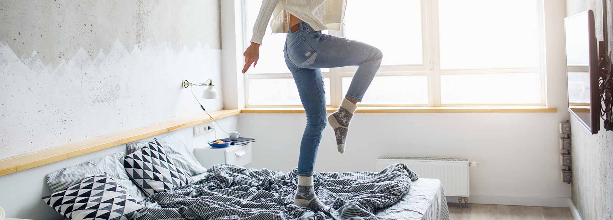 Girl dancing on bed