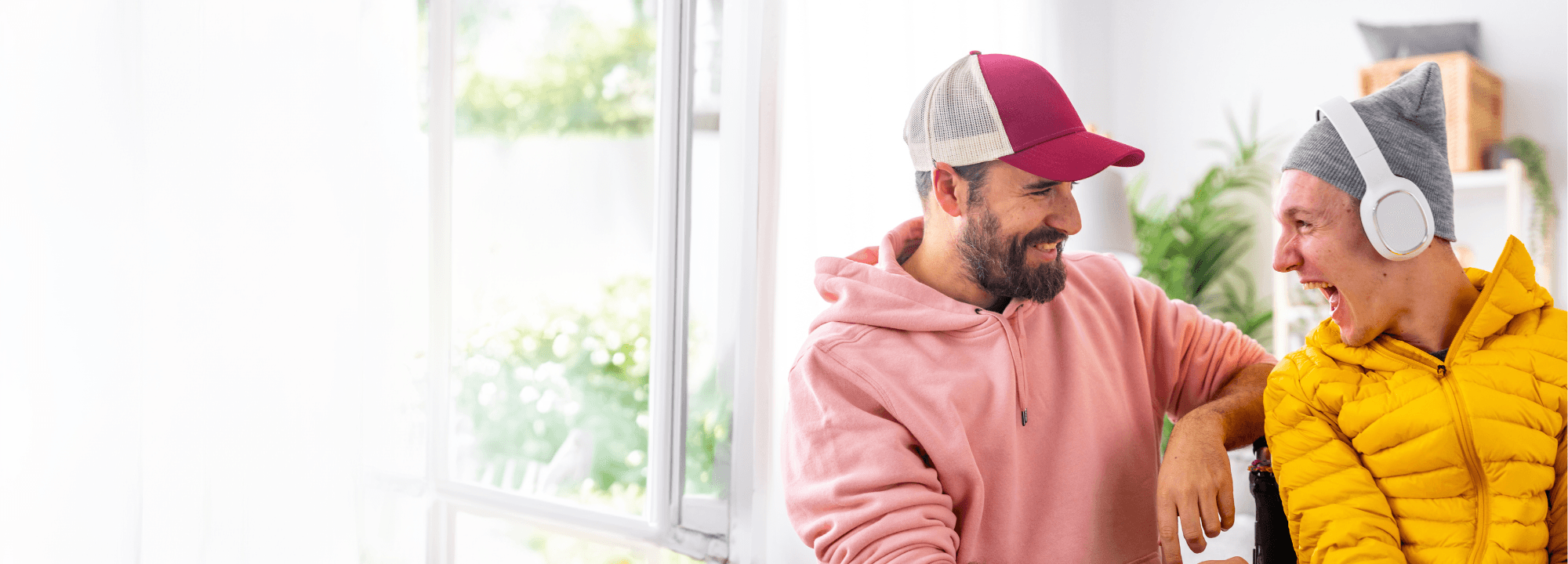 Man and teen laughing happily