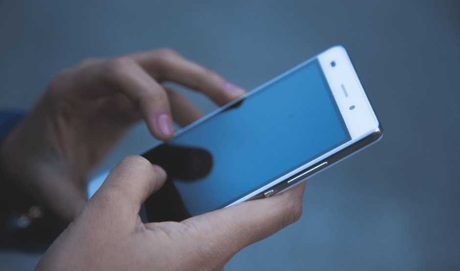 A woman's hands holding a smartphone