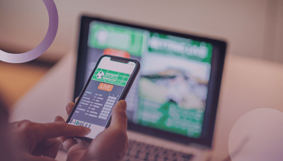 A person using their phone and a sports betting app