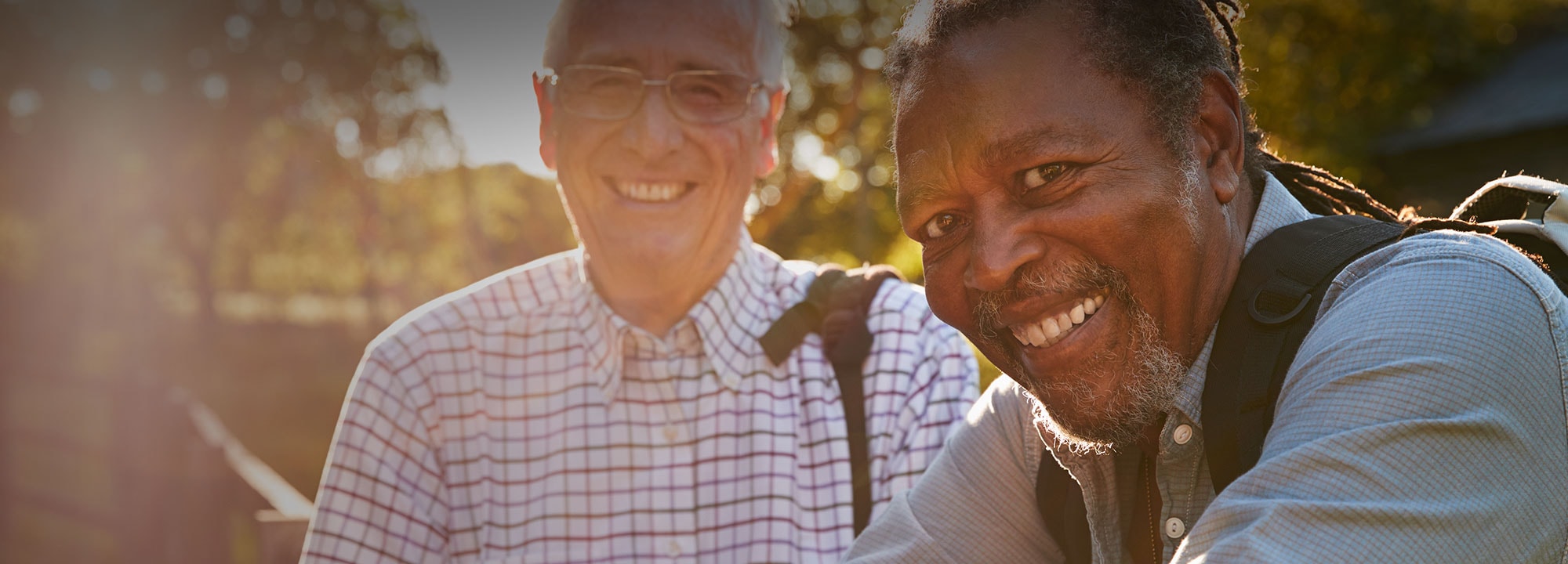 two men outside smiling and looking to the camera