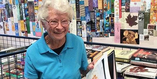 elderly lady browsing books