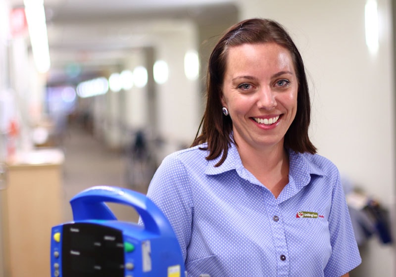 st stephen female worker smiling at camera