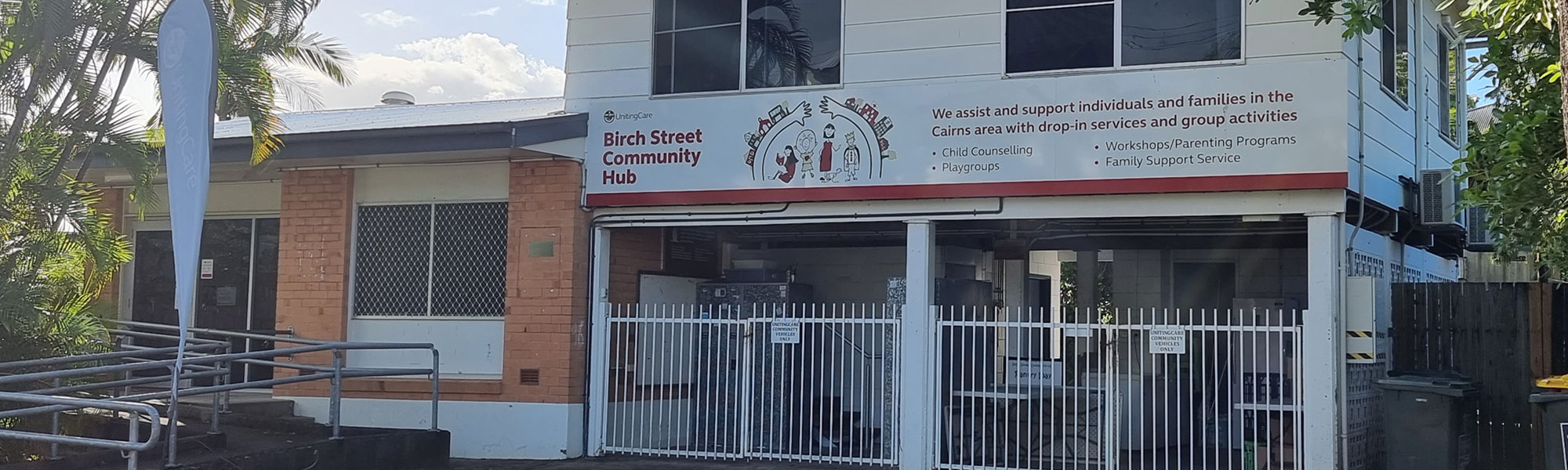 The exterior of the two-storey Birch Street Community Hub, which is flanked by trees.