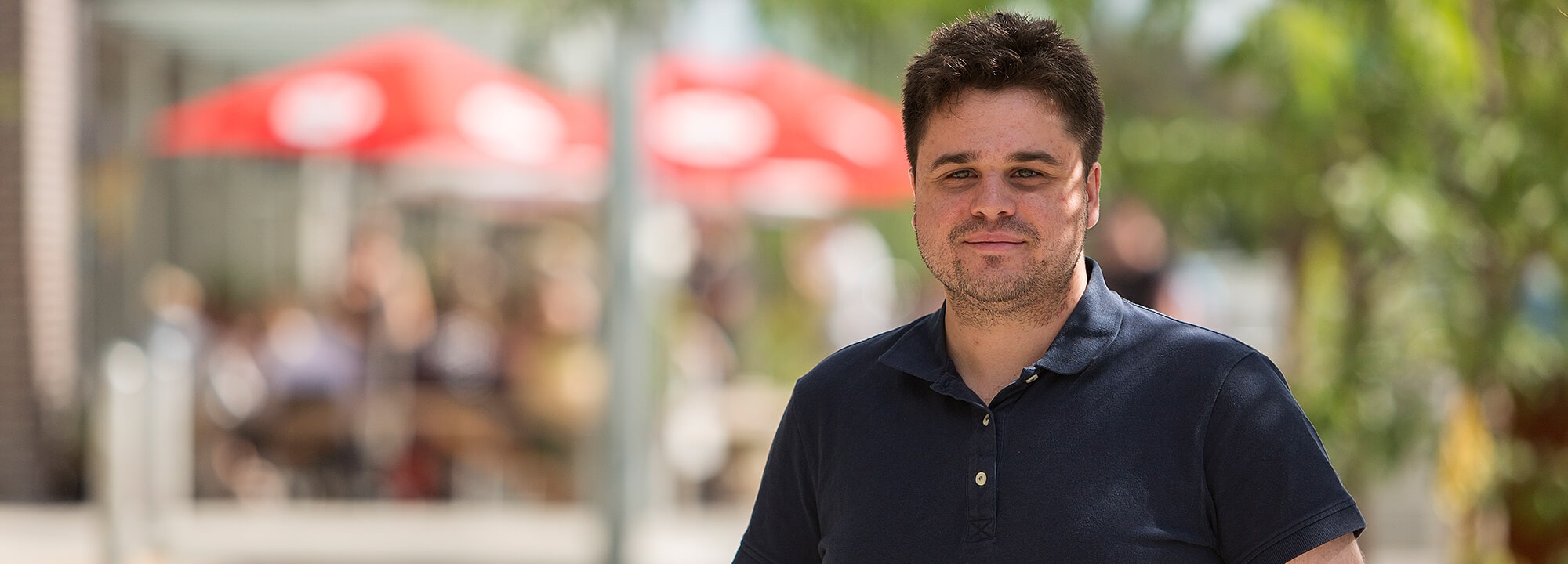 Man standing outside smiling at camera